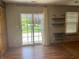 Bright living room with sliding door to backyard and modern decor accents, offering a cozy and inviting space at 8234 Crosser Dr, Indianapolis, IN 46237