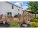 Multi-level backyard deck with hot tub, dining area, and well-maintained landscaping at 8316 Thorn Bend Dr, Indianapolis, IN 46278