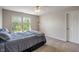 Cozy bedroom featuring natural light from two windows and neutral toned walls at 8316 Thorn Bend Dr, Indianapolis, IN 46278