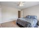 Bedroom with carpet has a ceiling fan, large windows, and space, creating a relaxing retreat at 8316 Thorn Bend Dr, Indianapolis, IN 46278