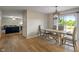 Dining area that connects to the living room, featuring a bright light fixture and natural lighting at 8316 Thorn Bend Dr, Indianapolis, IN 46278