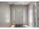 Bright foyer featuring hardwood floors, a front door with sidelights, and neutral paint at 8316 Thorn Bend Dr, Indianapolis, IN 46278