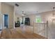Bright second story living room featuring hardwood floors, a ceiling fan, and plenty of natural light at 8316 Thorn Bend Dr, Indianapolis, IN 46278