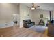 Bright living room boasts hardwood floors, a ceiling fan, and comfortable seating, creating an inviting space at 8316 Thorn Bend Dr, Indianapolis, IN 46278