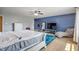 Spacious primary bedroom features hardwood floors, ample natural light, and a comfortable seating area at 8316 Thorn Bend Dr, Indianapolis, IN 46278