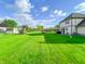 Beautiful backyard featuring expansive lawn, playground and great landscaping at 8798 Surrey Dr, Pendleton, IN 46064