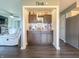 Stylish bar area with built-in cabinets, elegant glassware, and a view into the living room at 8798 Surrey Dr, Pendleton, IN 46064