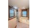 Bathroom with a tub, shower and two windows at 8798 Surrey Dr, Pendleton, IN 46064