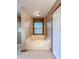 Bathroom featuring a large soaking tub under a window at 8798 Surrey Dr, Pendleton, IN 46064