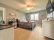 Spacious bedroom with neutral walls, ceiling fan, and a window with ample natural light at 8798 Surrey Dr, Pendleton, IN 46064
