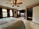 Bedroom with multiple windows, TV and a ceiling fan at 8798 Surrey Dr, Pendleton, IN 46064