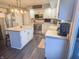 Bright kitchen featuring stainless steel appliances, white cabinets, a center island, and modern pendant lighting at 8798 Surrey Dr, Pendleton, IN 46064