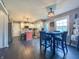 Open kitchen and dining area with an island, stainless steel appliances, and a modern dining table at 8798 Surrey Dr, Pendleton, IN 46064