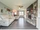 Comfortable living room with a stone fireplace, large TV, and a cozy sectional sofa at 8798 Surrey Dr, Pendleton, IN 46064