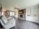 Spacious living room featuring built-in bookshelves and a stone fireplace, ideal for relaxing and entertaining at 8798 Surrey Dr, Pendleton, IN 46064