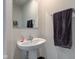 This bathroom features a white sink with chrome faucet and a grey towel at 900 Sunchaser Rd, Lebanon, IN 46052