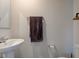 This bathroom features a white sink, a mirror, and a grey towel at 900 Sunchaser Rd, Lebanon, IN 46052