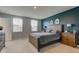 This bedroom is filled with natural light and features a queen sized bed at 900 Sunchaser Rd, Lebanon, IN 46052