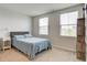 Neutral bedroom with large windows allowing natural light at 900 Sunchaser Rd, Lebanon, IN 46052