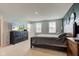 This bedroom features a TV, a queen sized bed, and neutral carpeting at 900 Sunchaser Rd, Lebanon, IN 46052