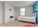 Bright bedroom with white furnishings and a basketball wall decoration at 900 Sunchaser Rd, Lebanon, IN 46052