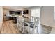 Dining area with a white table, matching chairs, and an adjacent kitchen at 900 Sunchaser Rd, Lebanon, IN 46052