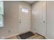 Inviting foyer with wood-look flooring, a closet, and a glass-accented front door at 900 Sunchaser Rd, Lebanon, IN 46052