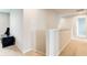 This carpeted hallway features white trim, and neutral paint at 900 Sunchaser Rd, Lebanon, IN 46052