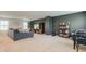 Spacious living room with stylish decor, plush seating, and ample natural light at 900 Sunchaser Rd, Lebanon, IN 46052