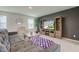 Inviting living room with comfortable seating, a modern media center, and ample natural light at 900 Sunchaser Rd, Lebanon, IN 46052