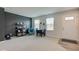 Bright living area featuring an accent wall, a cozy chair, and a dining table with seating at 900 Sunchaser Rd, Lebanon, IN 46052
