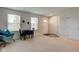 Bright and airy living room featuring a dining area and a large window at 900 Sunchaser Rd, Lebanon, IN 46052