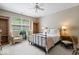 Comfortable bedroom featuring a metal bed frame, neutral walls, and bright natural light at 9317 Muir Ln, Fishers, IN 46037