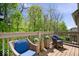 Outdoor deck with cozy seating, overlooking a lush green landscape at 9317 Muir Ln, Fishers, IN 46037