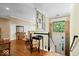 Welcoming foyer with hardwood floors, wainscoting, and a decorative stained glass panel at 9317 Muir Ln, Fishers, IN 46037