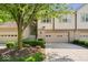 Charming townhome showcasing a well-maintained front yard and inviting entrance with a garage at 9317 Muir Ln, Fishers, IN 46037