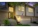 Inviting townhome entrance with decorative door and sidelight plus an attached garage with decorative windows at 9317 Muir Ln, Fishers, IN 46037
