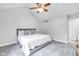 Carpeted bedroom with a vaulted ceiling and a ceiling fan, illuminated by natural light at 952 Junction Pl, Indianapolis, IN 46220