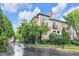 Corner lot featuring flowering landscape with mature trees offering a peaceful setting at 952 Junction Pl, Indianapolis, IN 46220