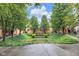 Exterior view of townhouses with fountain and lush green courtyard at 952 Junction Pl, Indianapolis, IN 46220