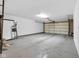 Spacious three-car garage with a clean, epoxy floor, overhead lighting, and plenty of room for storage at 952 Junction Pl, Indianapolis, IN 46220