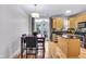 Eat-in kitchen featuring sleek countertops, island, stainless appliances and lots of light at 952 Junction Pl, Indianapolis, IN 46220