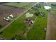 Aerial view of farm land with several houses, barns and a pond at 9621 N County Road 25 W, Muncie, IN 47303