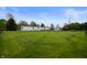 Expansive backyard featuring a well-maintained lawn and a white single-story home at 9621 N County Road 25 W, Muncie, IN 47303