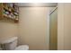 Bathroom featuring a toilet, and a shower with glass door at 9621 N County Road 25 W, Muncie, IN 47303