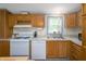 Functional kitchen featuring modern appliances, wood cabinets, and ample counter space at 9621 N County Road 25 W, Muncie, IN 47303