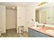 Bathroom featuring a single sink vanity and a bathtub with shower at 9955 Orange Blossom Trl, Fishers, IN 46038