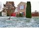 Charming two-story home with well-maintained lawn and landscape; red garage door and brick accents add a pop of color at 9955 Orange Blossom Trl, Fishers, IN 46038