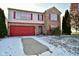Charming two-story home featuring a red garage door, red shutters, brick accents, and a well-maintained front yard at 9955 Orange Blossom Trl, Fishers, IN 46038