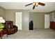 Living room with a brown leather recliner and a vintage-style side table at 9955 Orange Blossom Trl, Fishers, IN 46038